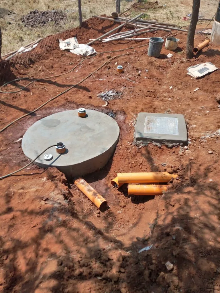 Biodigester tanks installed below ground at a school