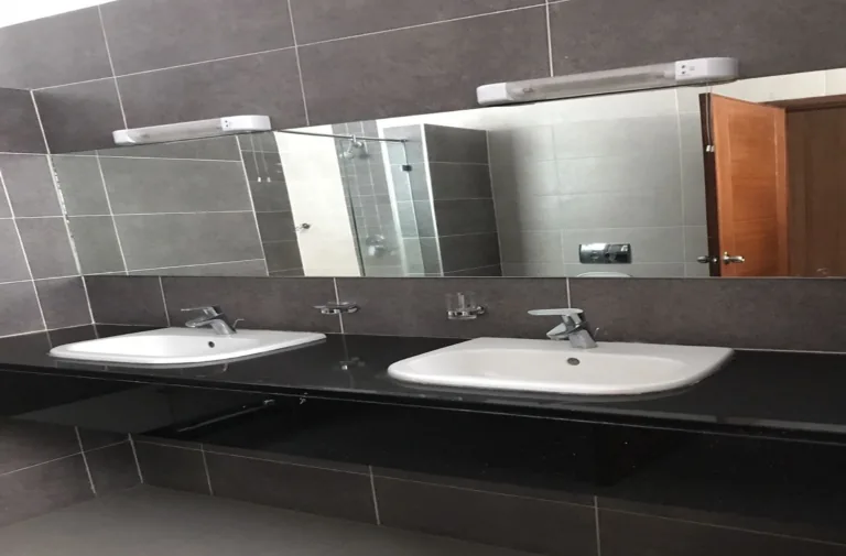 Renovated bathroom with wall-hung double basins