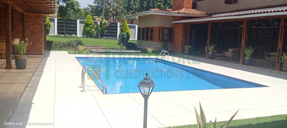 Finished swimming pool beside a Kenyan home