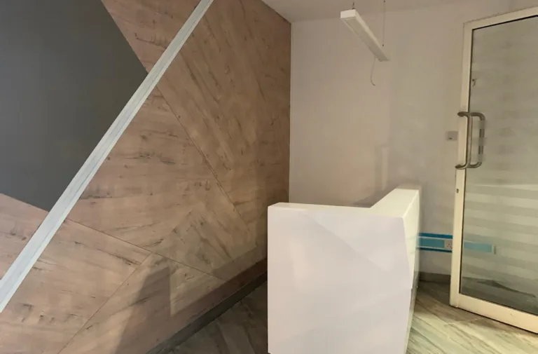 Marble-tiled shower enclosure
